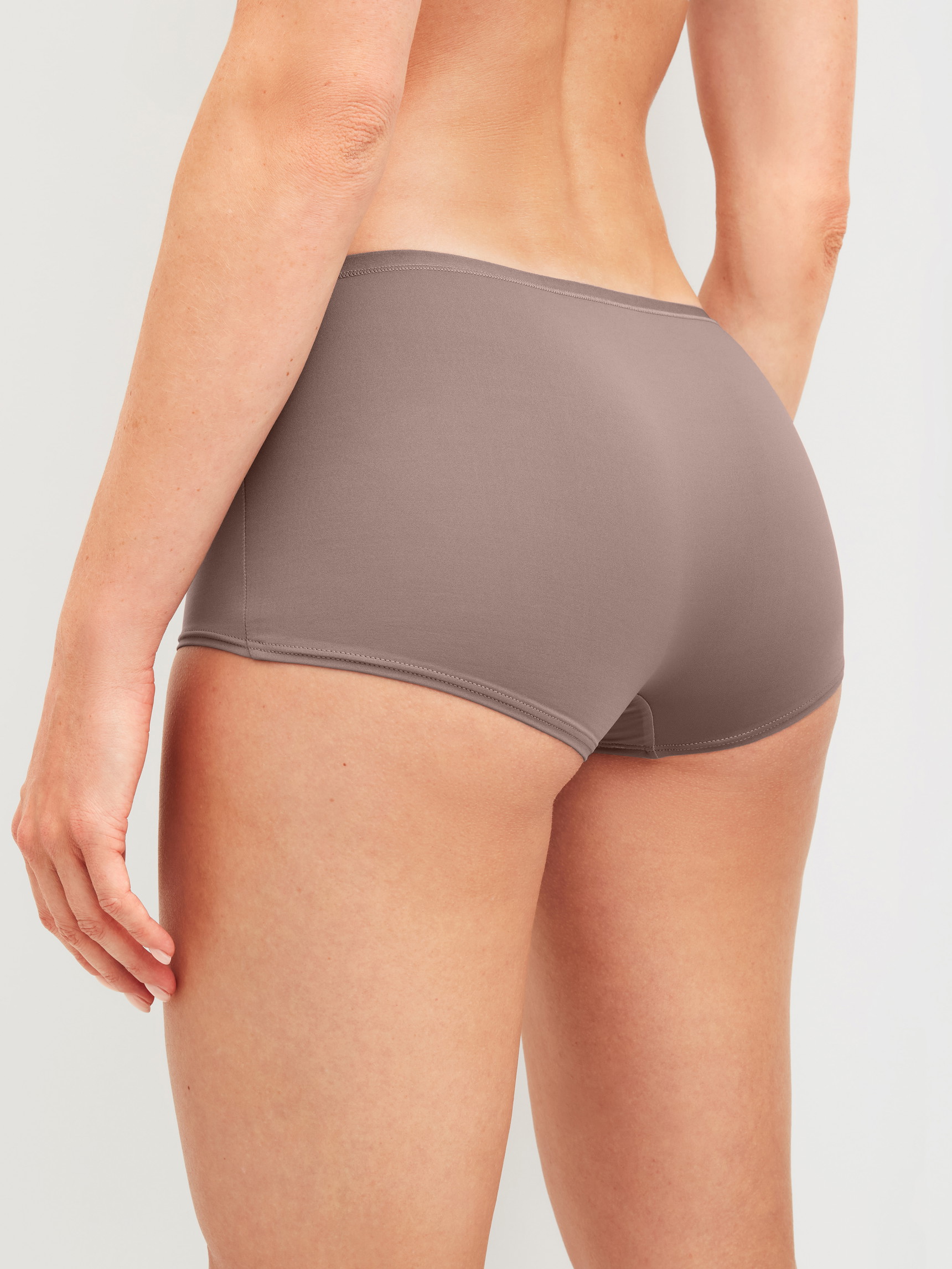 Women model is wearing Panties, 3-Pack made of Polyamide in Brown, Unicoloured from the Eco Sense Special series by CALIDA, Back view