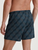La modella / Il modello Uomo indossa Boxer short in 100% cotone di colore Nero, Modello, della serie Prints di CALIDA, Vista posteriore