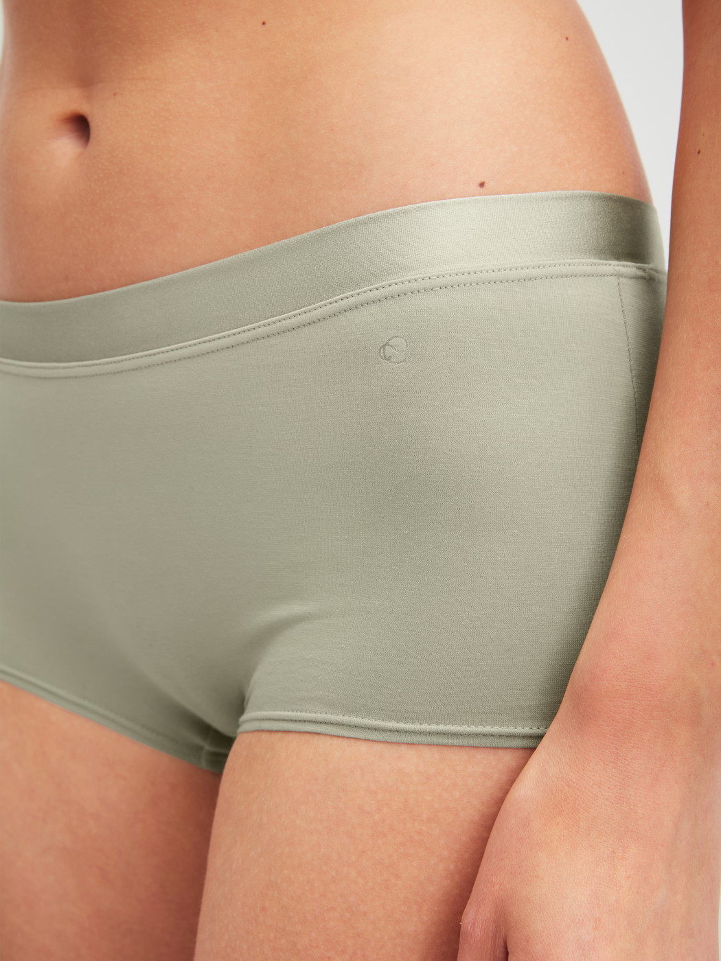 Women model is wearing Shorty regular cut made of Cotton in Green, Unicoloured from the Cate series by CALIDA, Front view