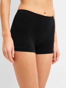 Women model is wearing Shorty regular cut made of Modal in Black, Unicoloured from the Seamless Natural series by CALIDA, Front view
