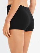 Women model is wearing Shorty regular cut made of Modal in Black, Unicoloured from the Seamless Natural series by CALIDA, Back view