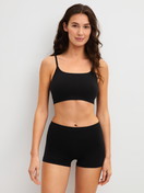 Women model is wearing Shorty regular cut made of Modal in Black, Unicoloured from the Seamless Natural series by CALIDA, Outfit