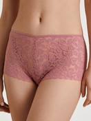 Women model is wearing Shorty regular cut made of Cotton in Pink, Lace from the Nat. Comfort Xtra series by CALIDA, Front view