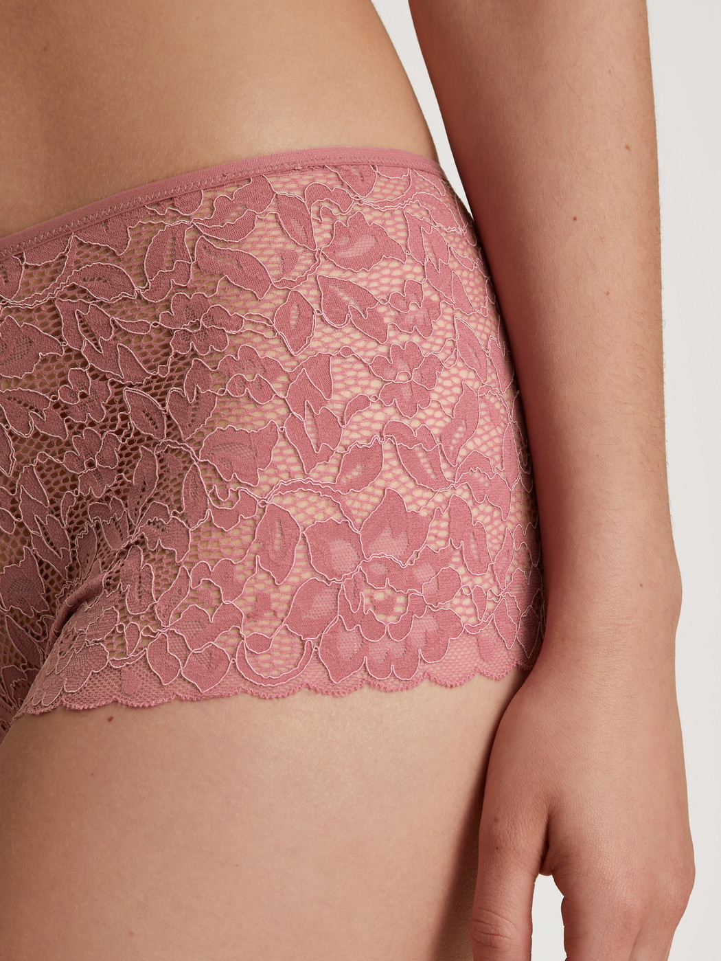 Women model is wearing Shorty regular cut made of Cotton in Pink, Lace from the Nat. Comfort Xtra series by CALIDA, Detail