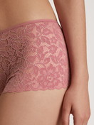 Women model is wearing Shorty regular cut made of Cotton in Pink, Lace from the Nat. Comfort Xtra series by CALIDA, Detail