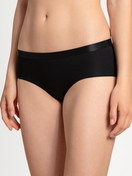 Women model is wearing Panty, 2-pack made of Cotton in Black, Unicoloured from the Benefit Women series by CALIDA, Front view