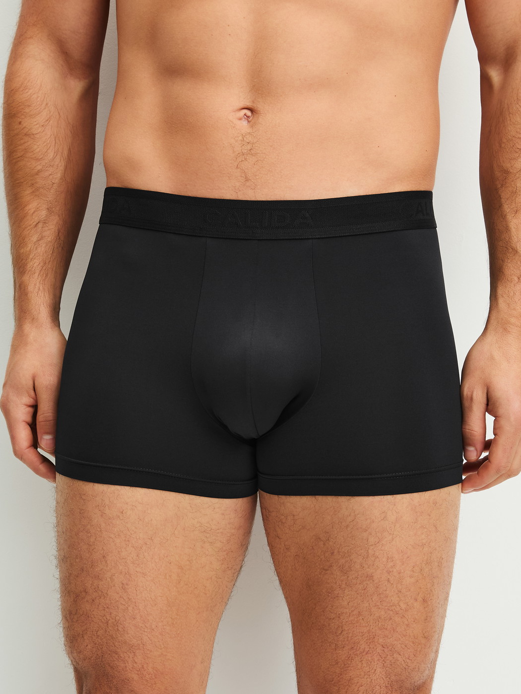 Men model is wearing Boxer brief made of Polyamide in Black, Unicoloured from the Micro Stretch series by CALIDA, Front view