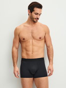 La modella / Il modello Uomo indossa  in Poliammide di colore Nero, Tinta unita, della serie Micro Stretch di CALIDA, Abbigliamento