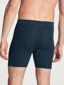 Men model is wearing Classic boxer brief with fly made of 100% Cotton in Blue, Unicoloured from the Cotton 1:1 series by CALIDA, Back view