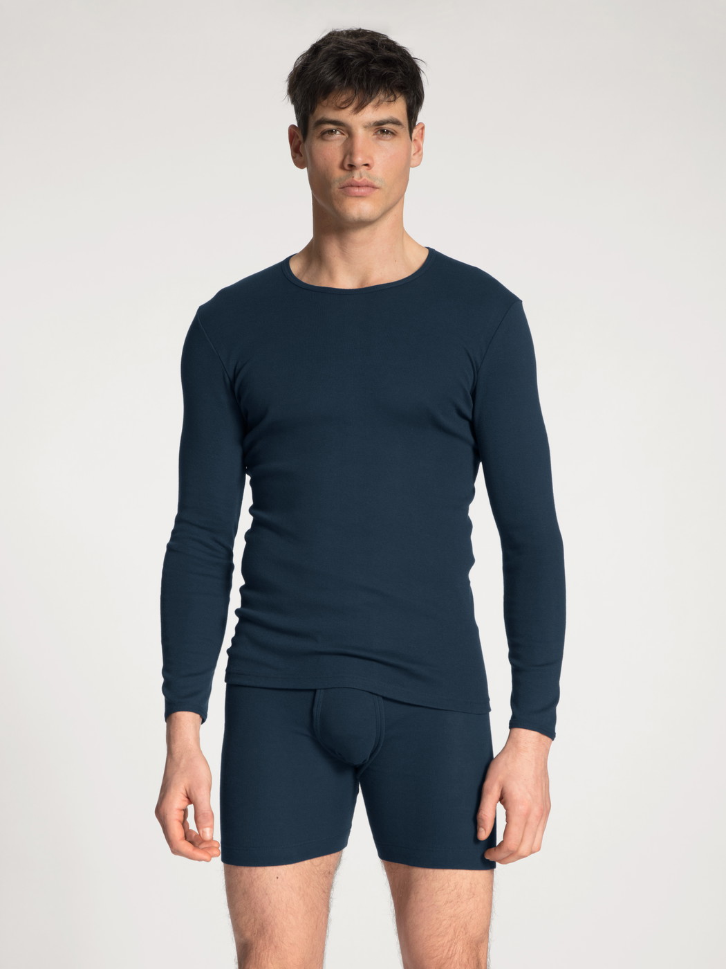 Men model is wearing Classic boxer brief with fly made of 100% Cotton in Blue, Unicoloured from the Cotton 1:1 series by CALIDA, Outfit, Front view