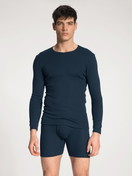 Men model is wearing Classic boxer brief with fly made of 100% Cotton in Blue, Unicoloured from the Cotton 1:1 series by CALIDA, Outfit, Front view