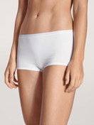 Women model is wearing Shorty regular cut made of Cotton in White, Unicoloured from the Natural Comfort series by CALIDA, Front view