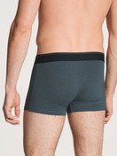 Men model is wearing Boxer brief made of Cotton in Blue, Unicoloured from the Cotton Stretch series by CALIDA, Back view
