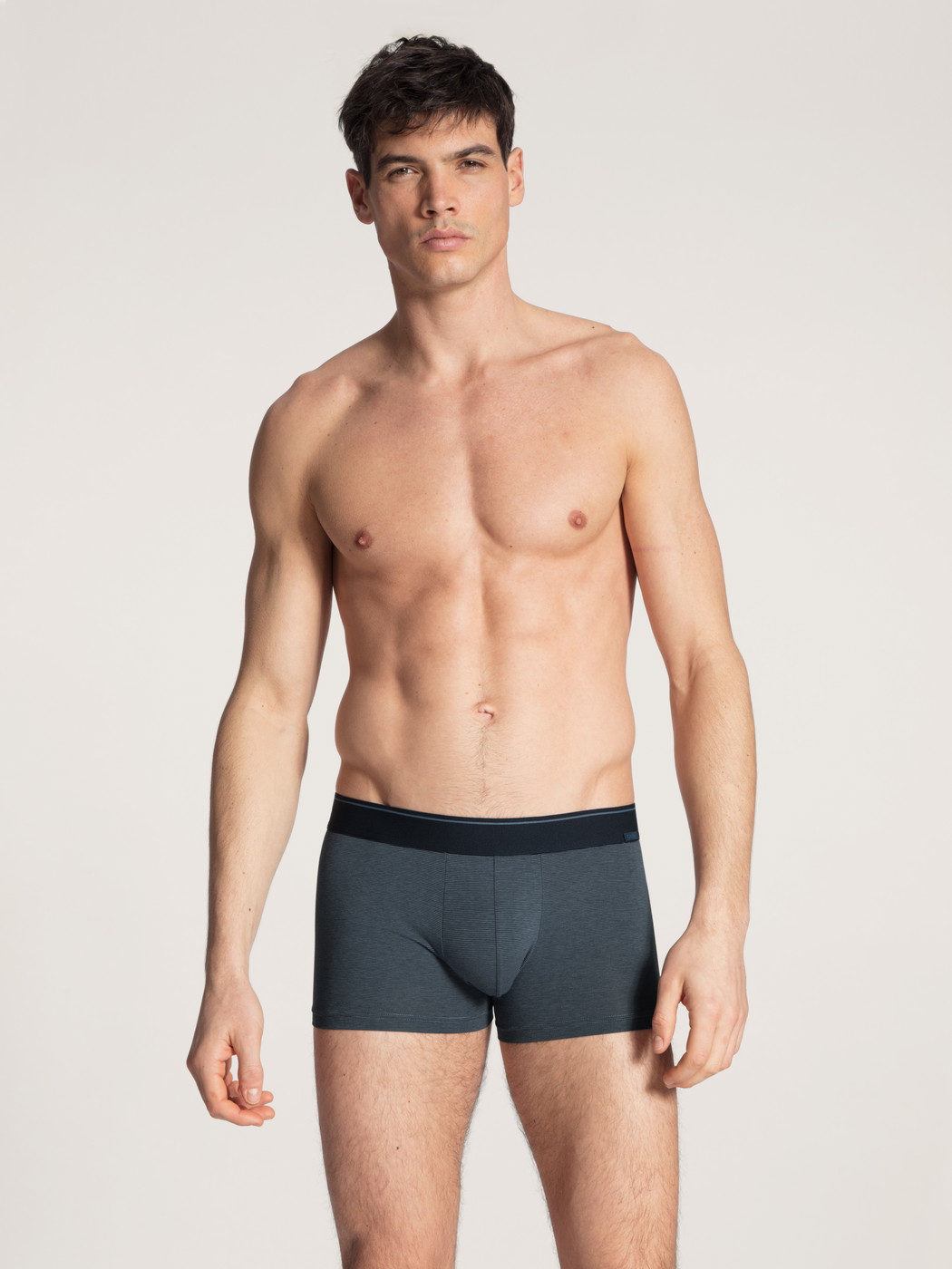 Men model is wearing Boxer brief made of Cotton in Blue, Unicoloured from the Cotton Stretch series by CALIDA, Outfit, Front view
