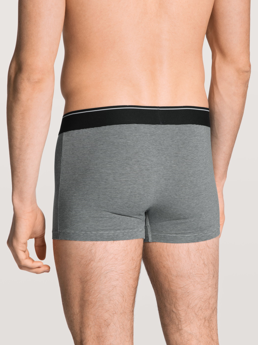 Men model is wearing Boxer brief made of Cotton in Grey, Unicoloured from the Cotton Stretch series by CALIDA, Back view