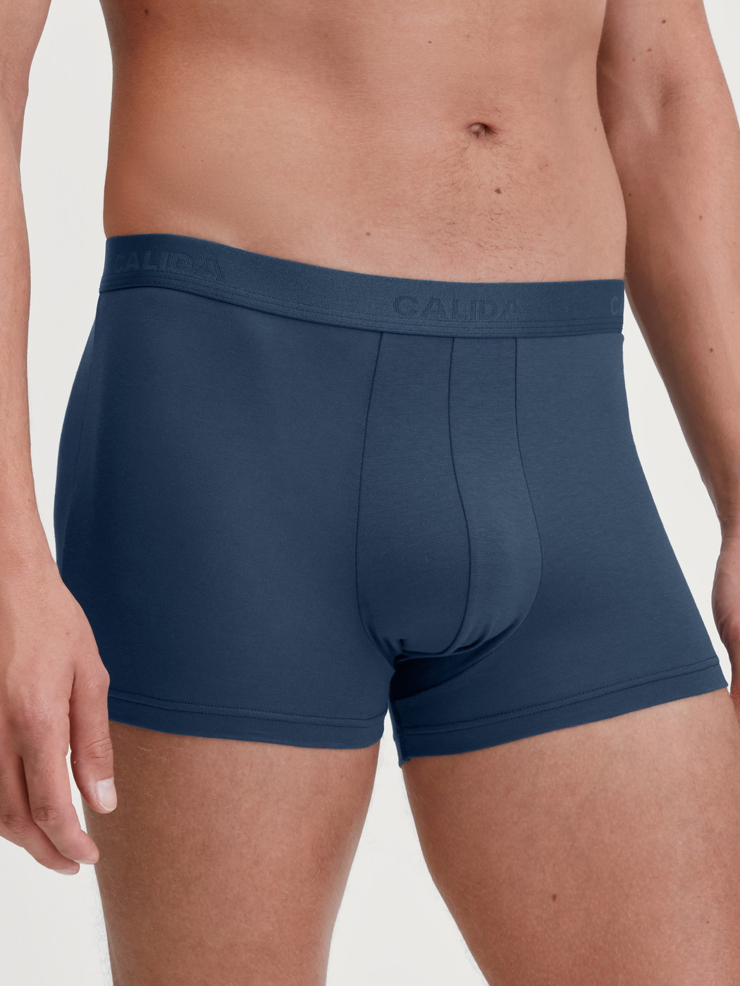 Men model is wearing Boxer brief made of Cotton in Blue, Unicoloured from the Evolution series by CALIDA, Front view