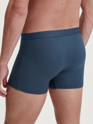 Men model is wearing Boxer brief made of Cotton in Blue, Unicoloured from the Evolution series by CALIDA, Back view
