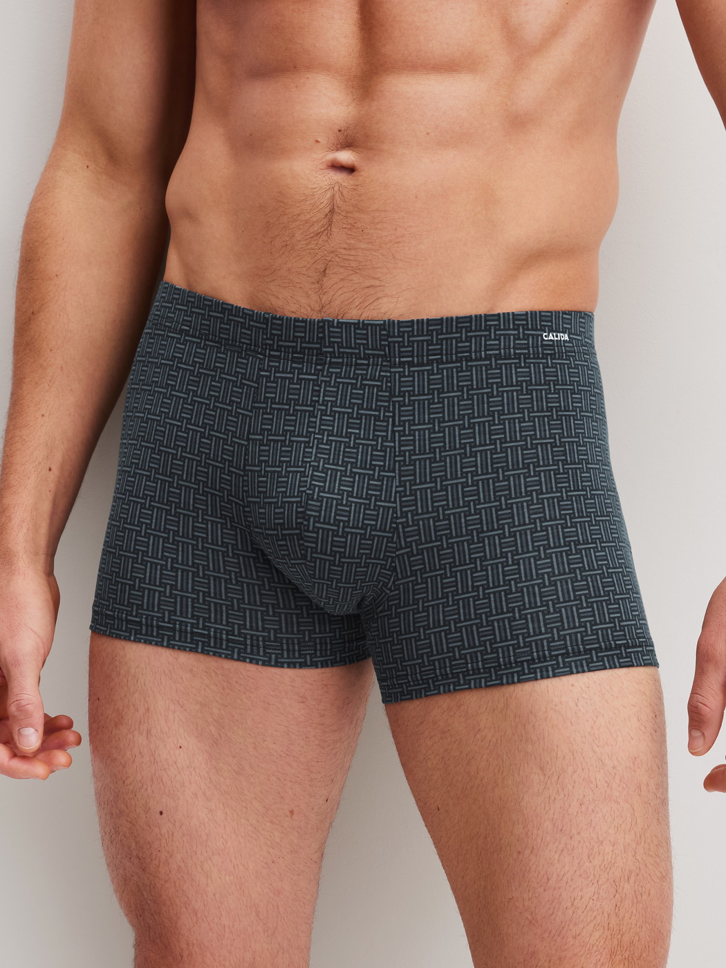 Men model is wearing Boxer brief made of Cotton in Black, Patterned from the Cotton Code Design series by CALIDA, Front view