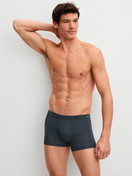 Men model is wearing Boxer brief made of Cotton in Black, Patterned from the Cotton Code Design series by CALIDA, Outfit