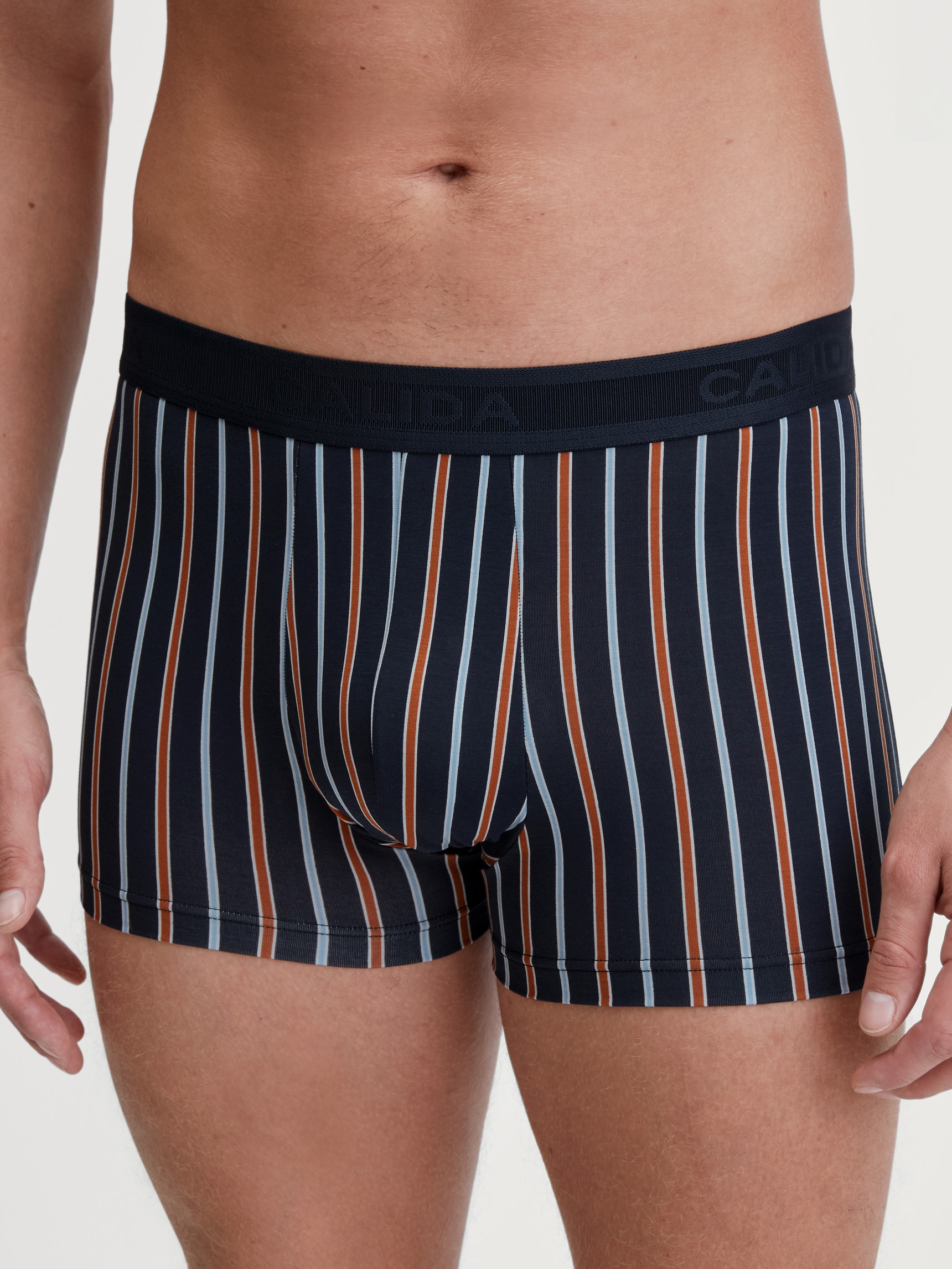 Men model is wearing Boxer brief made of Cotton in Orange, Patterned from the Grafic Cotton series by CALIDA, Front view