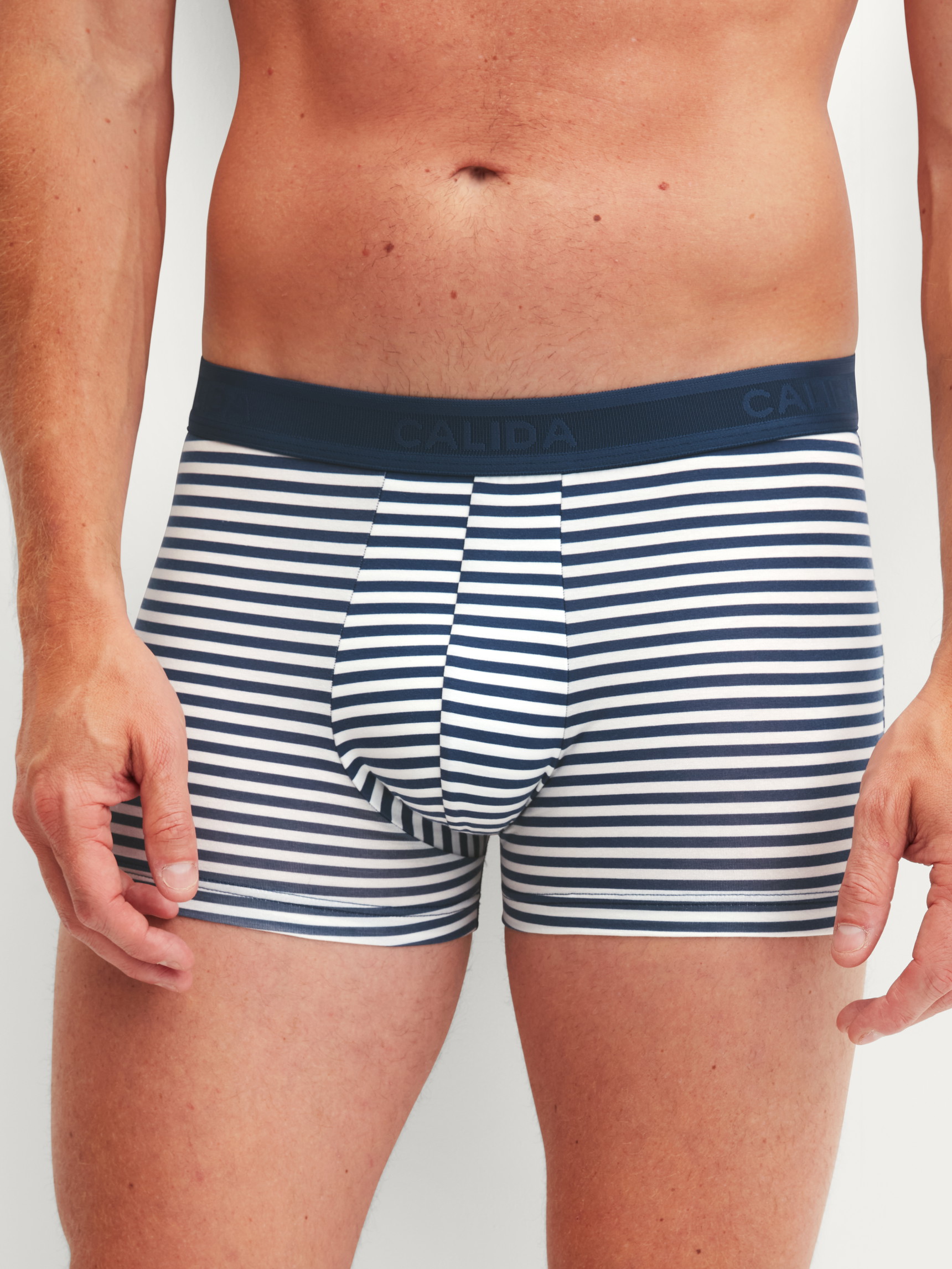 Men model is wearing Boxer brief made of Cotton in Blue, Striped from the Grafic Cotton series by CALIDA, Front view