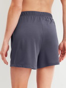 Women model is wearing Loungeshorts made of Modal in Blue, Unicoloured from the Natural Loungewear series by CALIDA, Back view