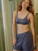 Women model is wearing Loungeshorts made of Modal in Blue, Unicoloured from the Natural Loungewear series by CALIDA, Additional Image