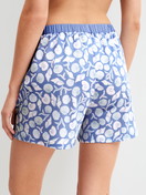 Women model is wearing Pyjama shorts made of 100% Cotton in Blue, Floral from the Favourites Ocean series by CALIDA, Back view