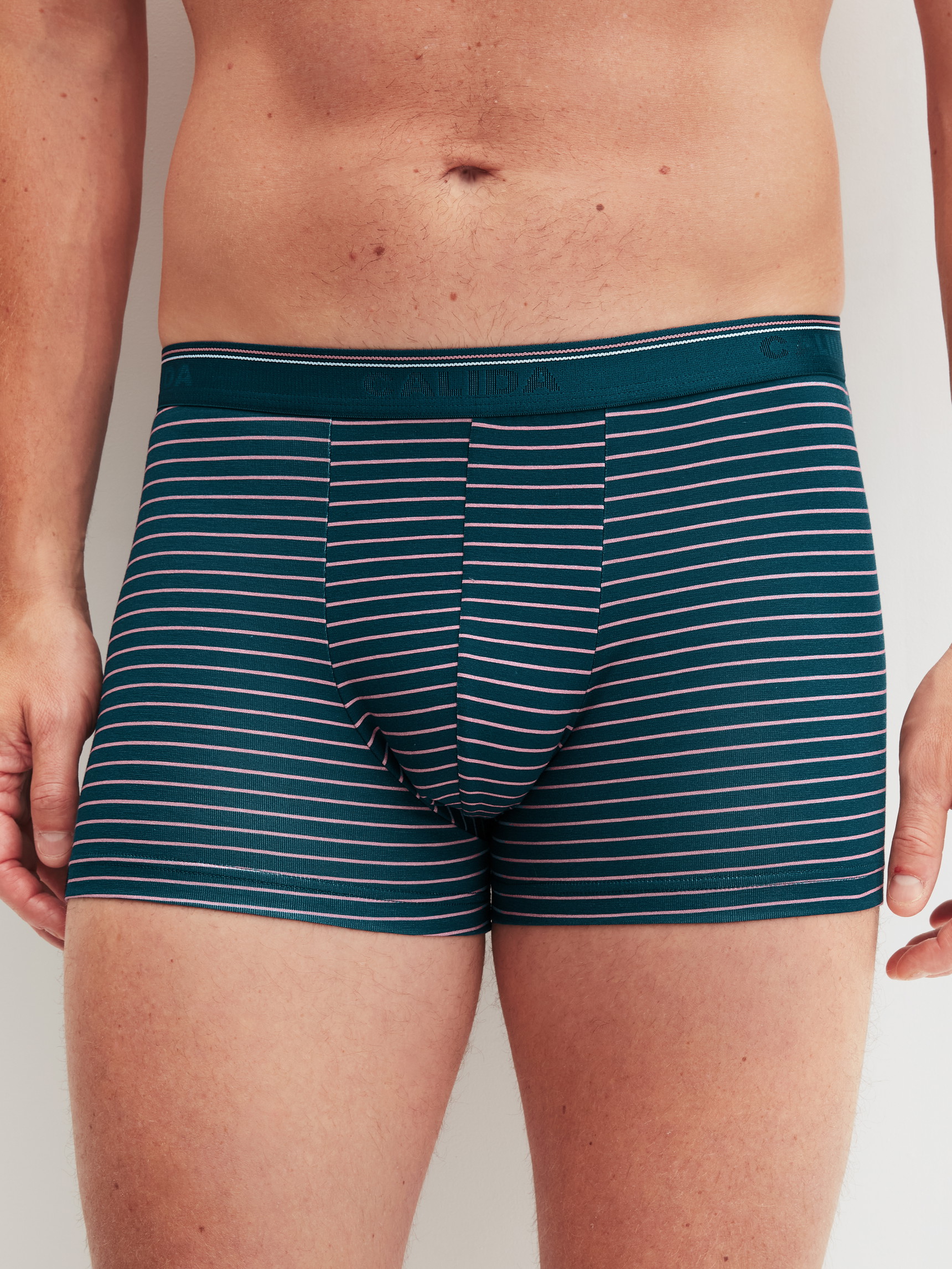 Men model is wearing Boxer Briefs, 3-Pack made of Cotton in Blue, Striped from the Natural Benefit series by CALIDA, Front view