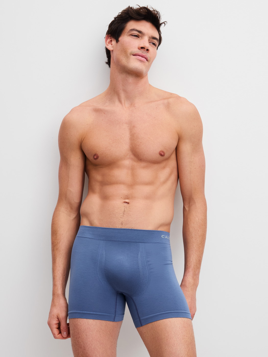 Men model is wearing Boxer briefs with longer leg made of Modal in Blue, Unicoloured from the Seamless Natural series by CALIDA, Outfit
