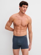 Men model is wearing Boxer briefs with longer leg made of Modal in Grey, Unicoloured from the Seamless Natural series by CALIDA, Outfit