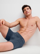 Men model is wearing Boxer briefs with longer leg made of Modal in Grey, Unicoloured from the Seamless Natural series by CALIDA, Additional Image