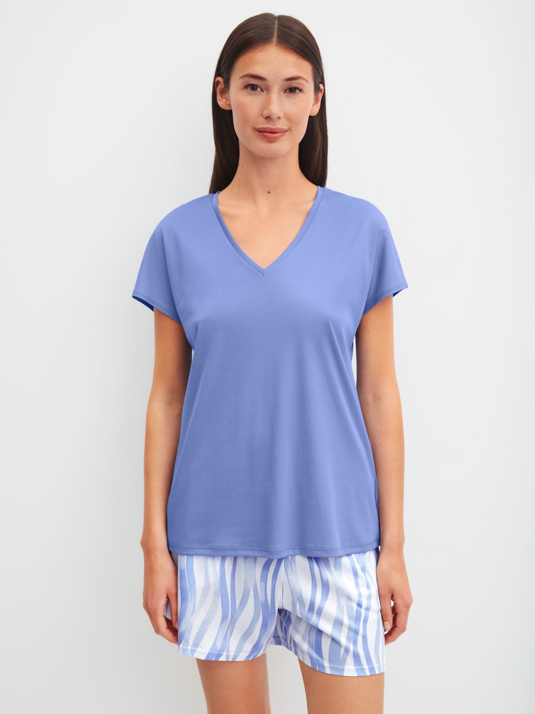 Women model is wearing Pyjama shorts made of Cotton in Blue, Patterned from the Favourites Ocean series by CALIDA, Outfit