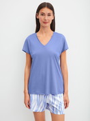 Women model is wearing Pyjama shorts made of Cotton in Blue, Patterned from the Favourites Ocean series by CALIDA, Outfit