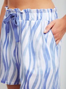 Women model is wearing Pyjama shorts made of Cotton in Blue, Patterned from the Favourites Ocean series by CALIDA, Detail