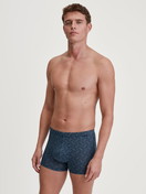 Men model is wearing Boxer brief made of TENCEL™ in Blue, Patterned from the Focus Trend series by CALIDA, Outfit
