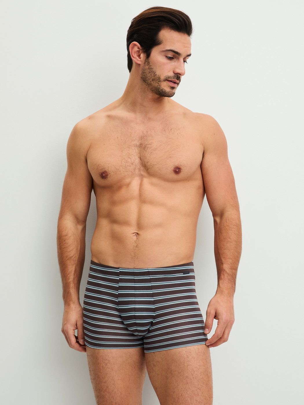 Men model is wearing Boxer brief made of Lyocell in Brown, Striped from the Focus Trend series by CALIDA, Front view