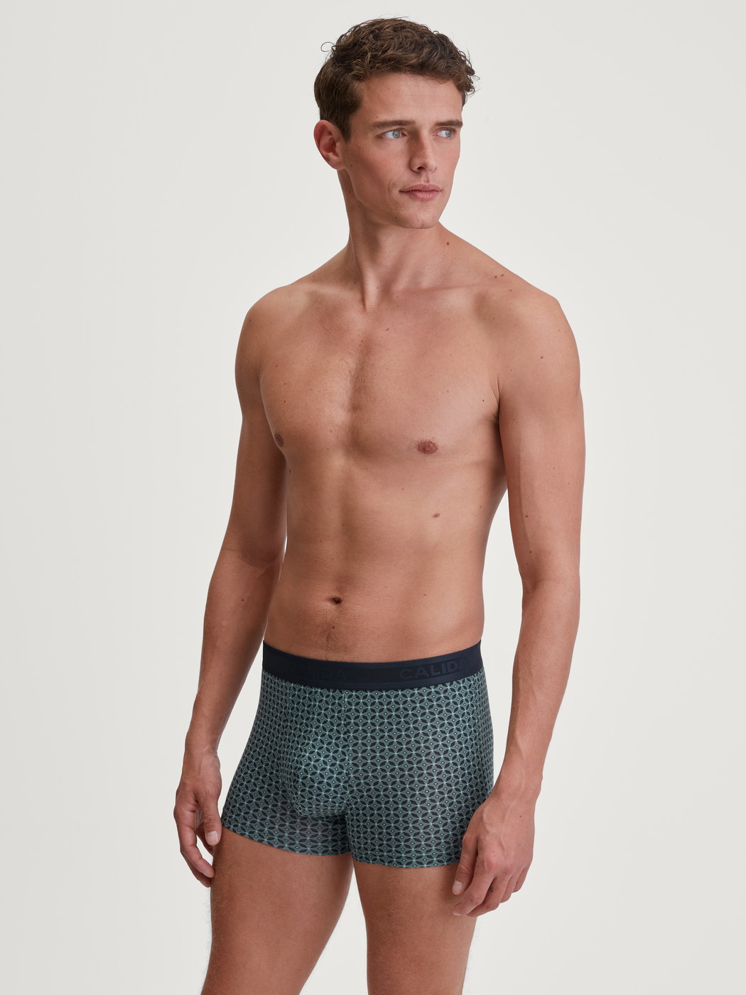 Men model is wearing Boxer brief made of TENCEL™ in Green, Patterned from the Focus Trend series by CALIDA, Outfit