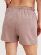 Women model is wearing Pyjama shorts made of 100% Cotton in Brown, Unicoloured from the Favourites Tiles series by CALIDA, Back view