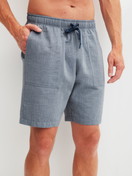 Men model is wearing Bermudas with side pockets made of 100% Cotton in Grey, Unicoloured from the RMX Sleep Journey series by CALIDA, Front view