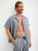 Men model is wearing Bermudas with side pockets made of 100% Cotton in Grey, Unicoloured from the RMX Sleep Journey series by CALIDA, Additional Image