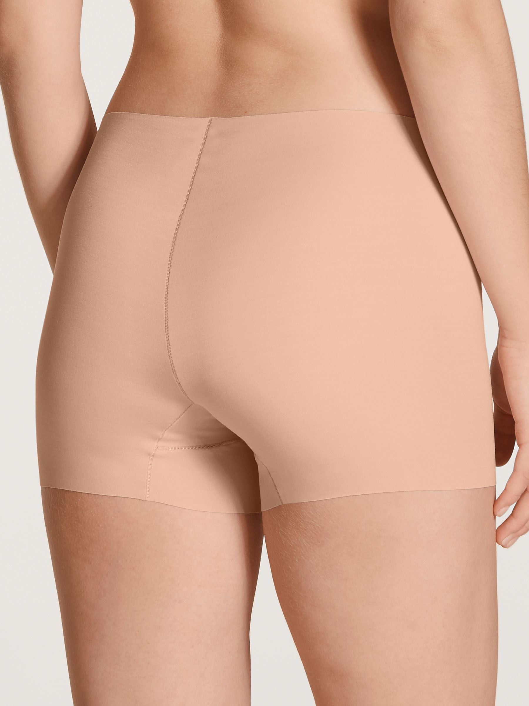 Women model is wearing Pants made of Modal in Pink, Unicoloured from the Natural Skin series by CALIDA, Back view