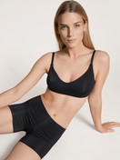 Women model is wearing Pants made of Modal in Black, Unicoloured from the Natural Skin series by CALIDA, Front view, Outfit
