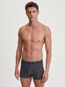 Men model is wearing Boxer brief made of Cotton in Orange, Striped from the Grafic Cotton series by CALIDA, Outfit