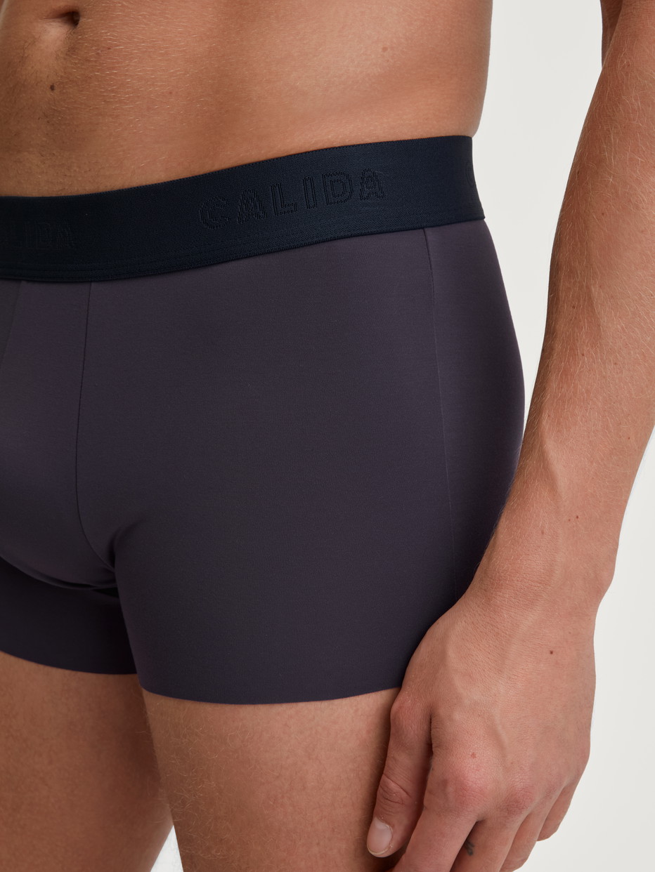 Men model is wearing Boxer brief with elastic waistband made of TENCEL™ in Blue, Unicoloured from the Clean Line series by CALIDA, Detail
