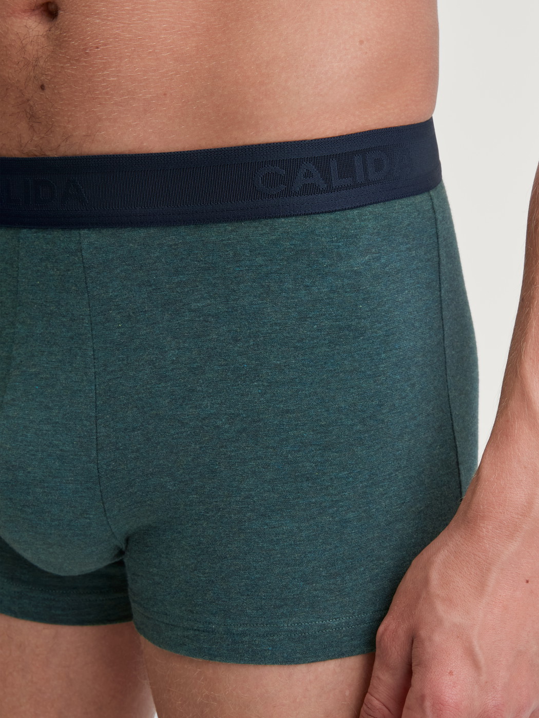 Men model is wearing Boxer brief made of Cotton in Green, Unicoloured from the Cotton Sporty series by CALIDA, Detail