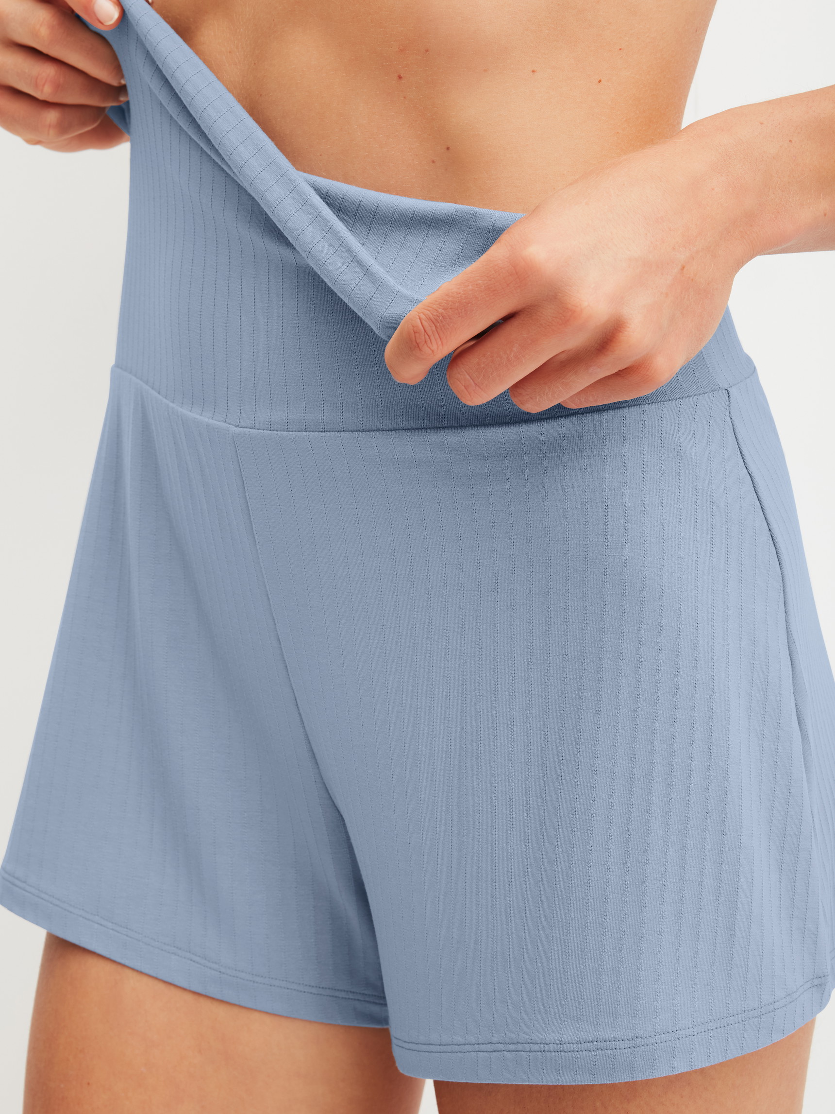 Women model is wearing Shorts made of Modal in Blue, Unicoloured from the Etude Ajours series by CALIDA, Detail
