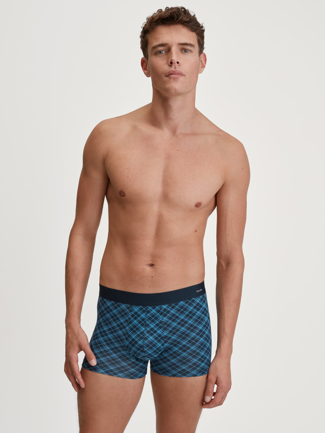 Men model is wearing Boxer brief made of Cotton in Blue, Checked from the Cotton Code Design series by CALIDA, Outfit