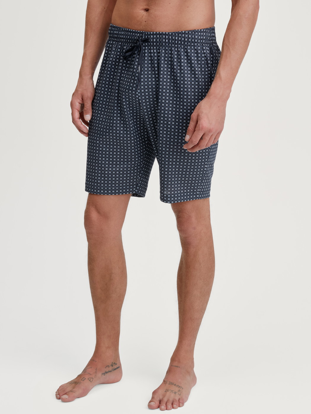 Men model is wearing Bermudas made of 100% Cotton in Blue, Checked from the Remix Basic Sleep series by CALIDA, Front view