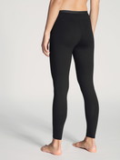 Women model is wearing Leggings made of Cotton in Black, Unicoloured from the Natural Comfort series by CALIDA, Back view